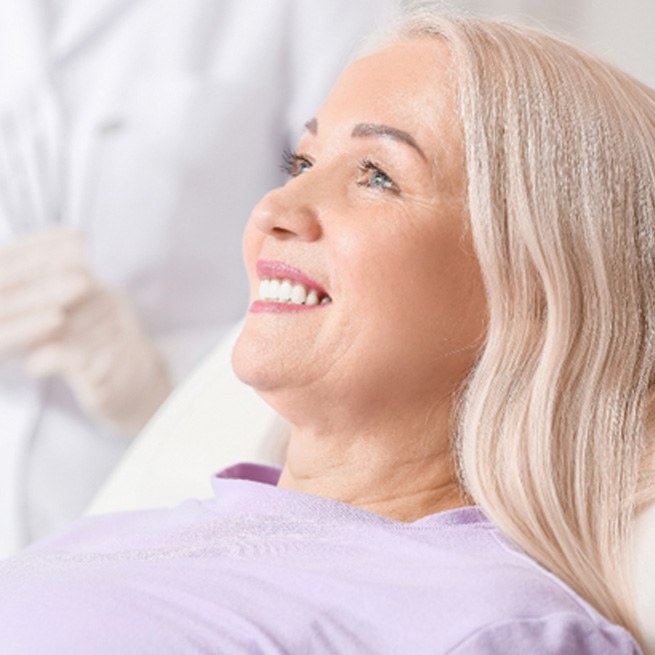 Woman smiling at the dentist’s office 