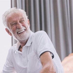 Man with dentures laughing