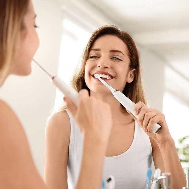 Woman brushing her teeth