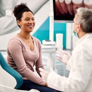 A woman and her dentist discuss after a regular dental checkup in Burien