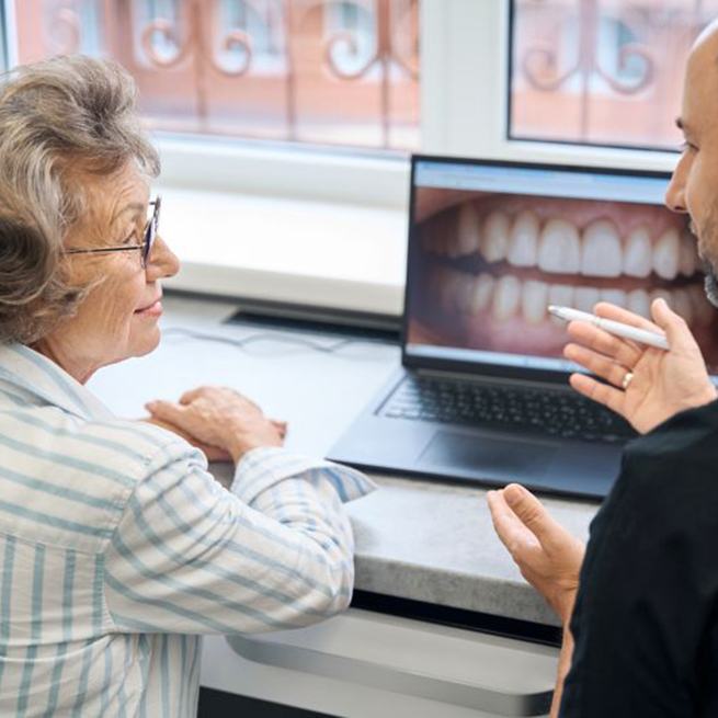 Dentist and patient reviewing treatment plan