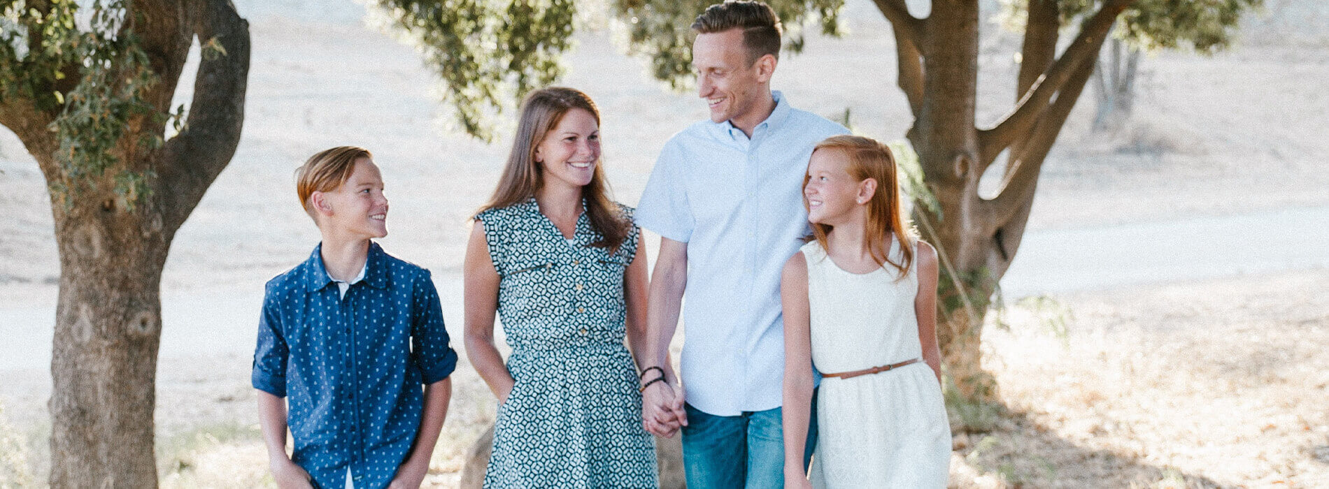 Family of four walking outdoors