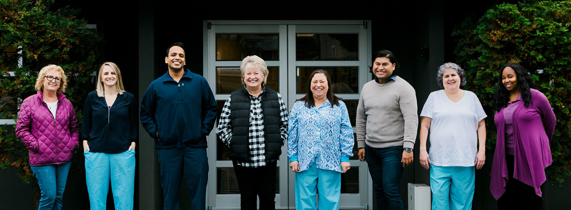 Dentist and dental team members outside of Burien dental office