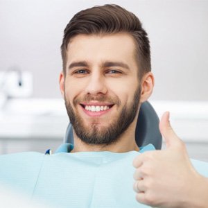 Man giving thumbs up for nitrous oxide sedation in Burien 