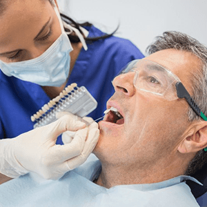 a patient undergoing the veneer process in Burien