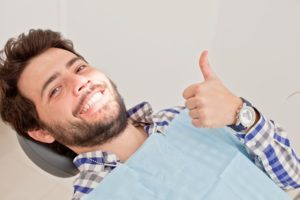 man giving thumbs up after needing an emergency dentist in Burien