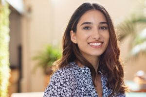 woman smiling after getting a filling