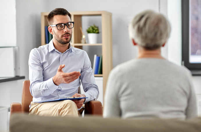 patient talking to dental professional about dental insurance